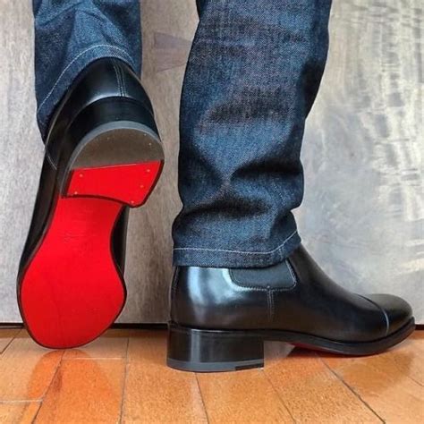 men's boots with red soles.